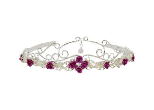 Royal Rose Crown silver floral headpiece with pink roses and green crystal drop, front view on white background.