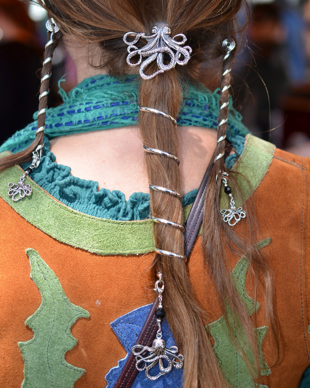 Complete Cthulhu hair accessory set with 6-inch silver spiral ponytail wrap holder and matching 4-inch Hair Twisters, featuring an octopus centerpiece and octopus dangle charms, worn by model from the back.