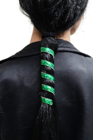 Model wearing 12 inch holographic green faux leather ponytail wrap, spiral design, back view in ponytail