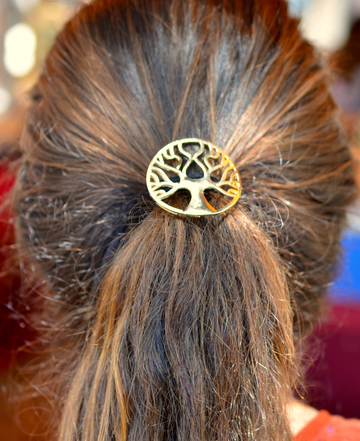 Model wearing a Gold Tree of Life Hair Hook securing a ponytail with an intricate Celtic Tree of Life design.