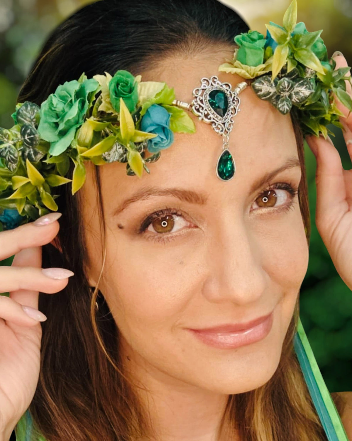 Model wearing a floral crown headpiece with green gemstones, Celtic-inspired boho fantasy hair jewelry for festivals and Renaissance Faire costumes.