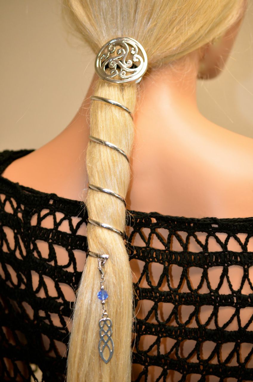Model wearing complete silver ponytail wrap set with matching spiral hair wrap, decorative hair hook and Celtic charm in a long ponytail
