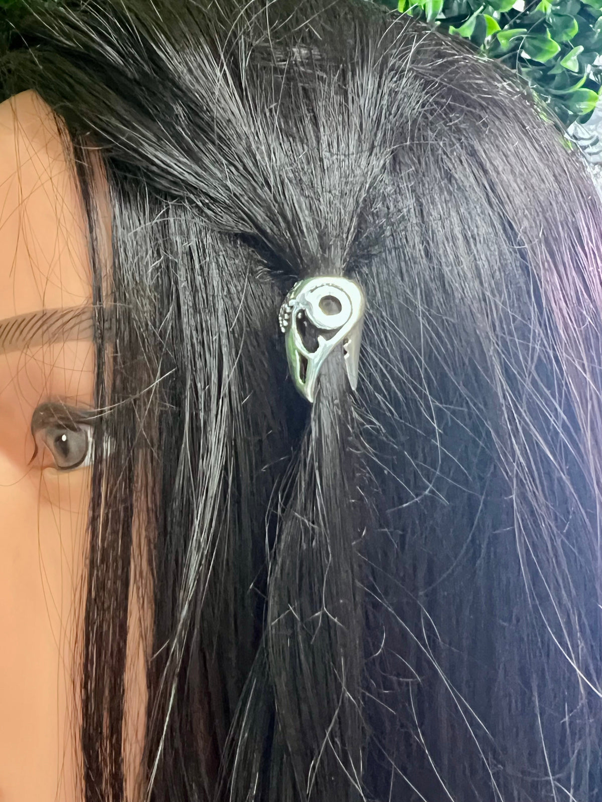 Raven Skull Hair Bead worn by model in black hair for braids and locs