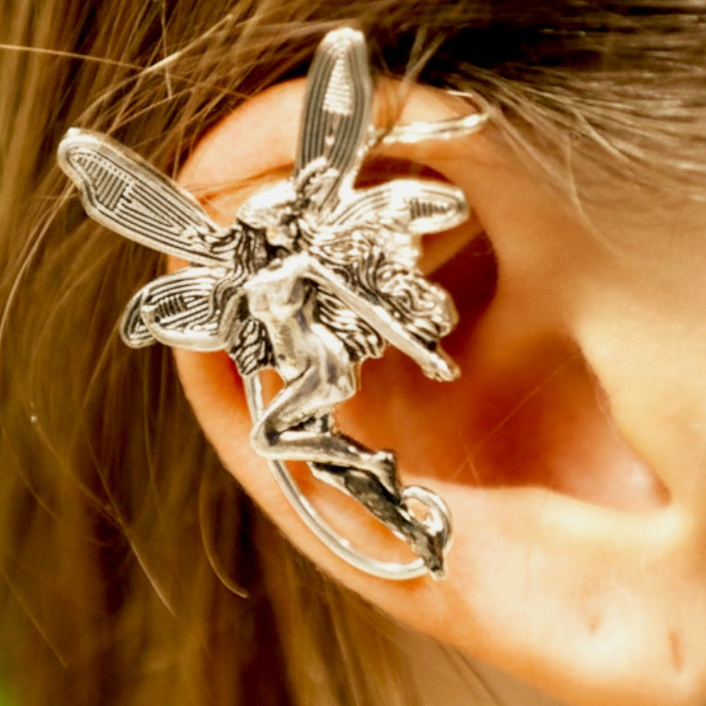 Silver fairy elf ear cuff worn on ear, fantasy-inspired no-piercing ear jewelry by Medieval Metal