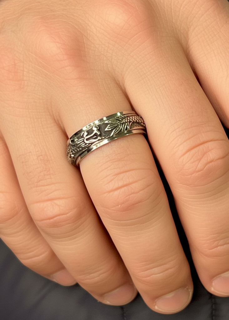 stainless steel dragon spinner ring worn on hand rotating band close up