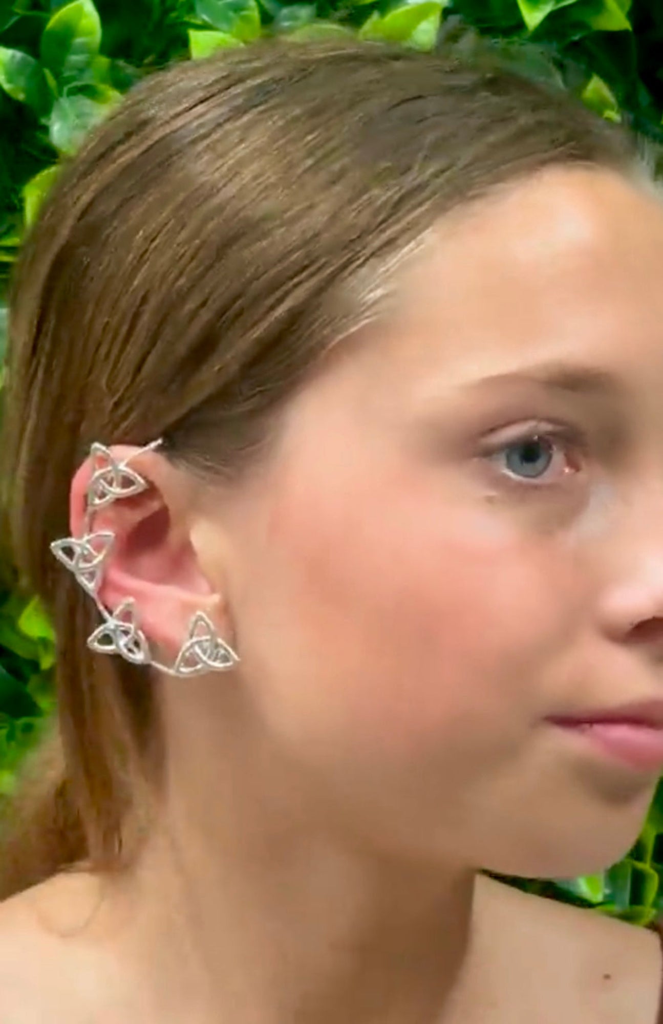 Silver Celtic knot elf ear cuffs worn along ear cartilage, side profile