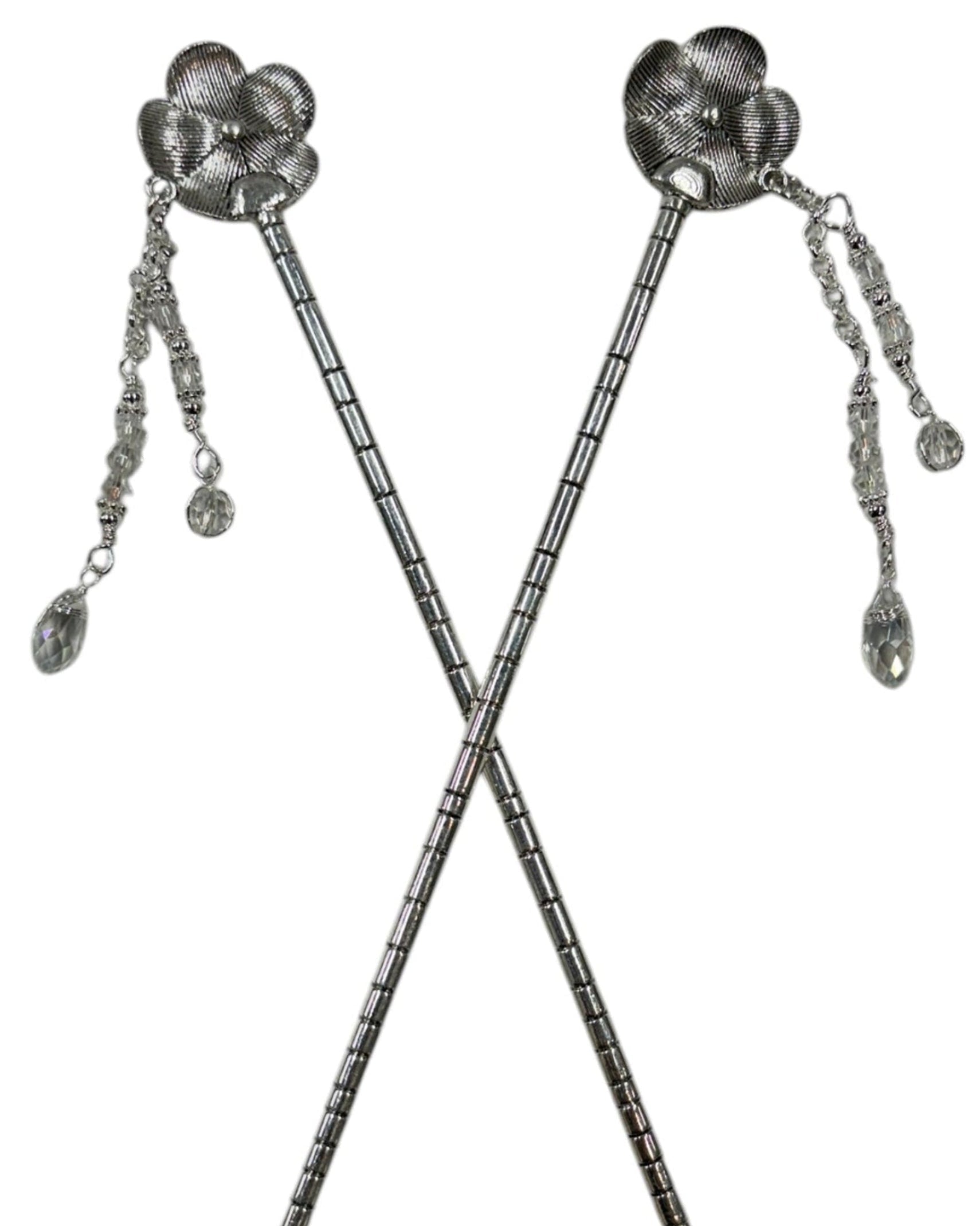 Pair of silver flower hair sticks with crystal bead dangle chains, shown crossed on a white background to display the back view and floral design.