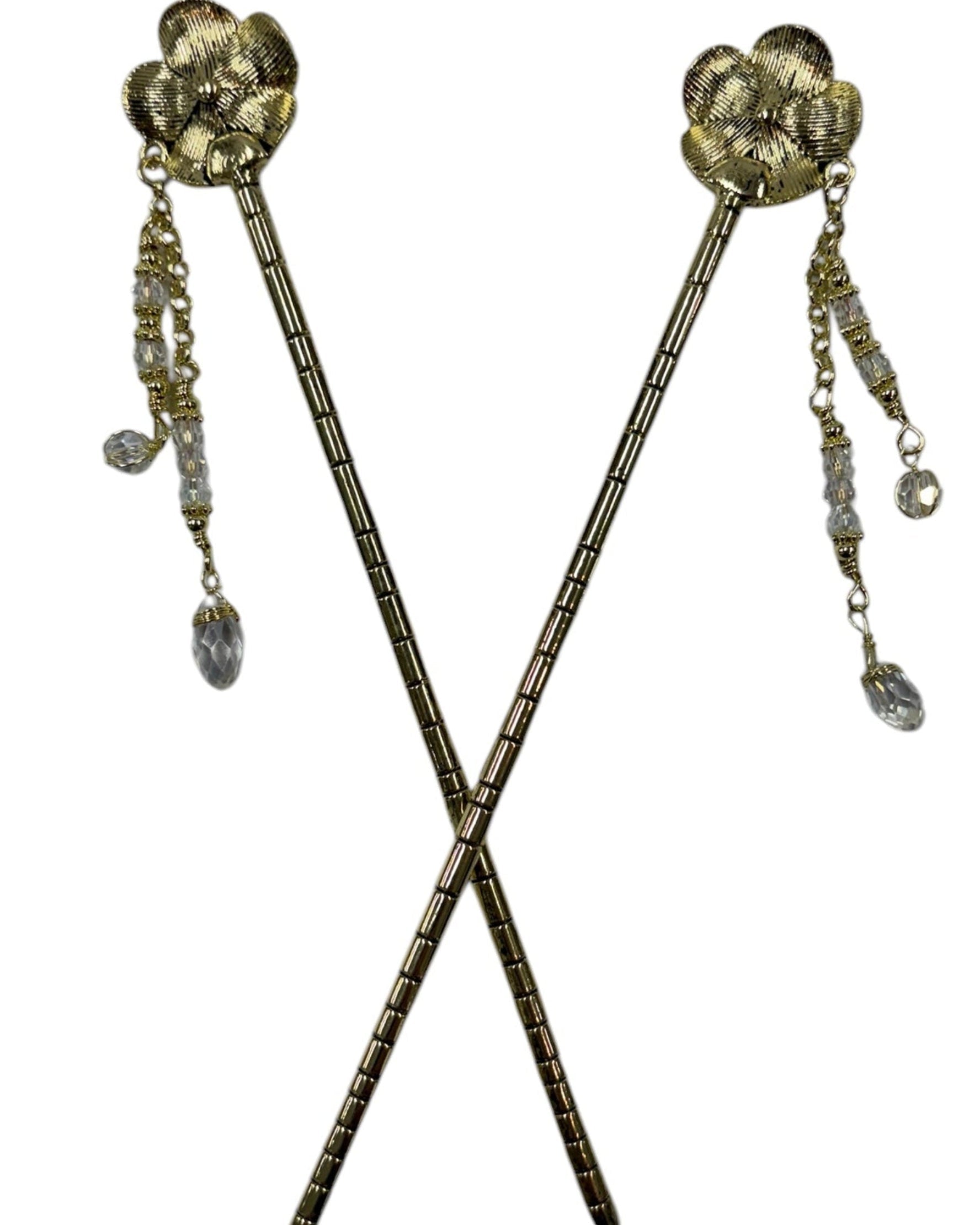 Pair of gold flower hair sticks with crystal bead dangle chains, shown crossed on a white background to display the back view and floral design.