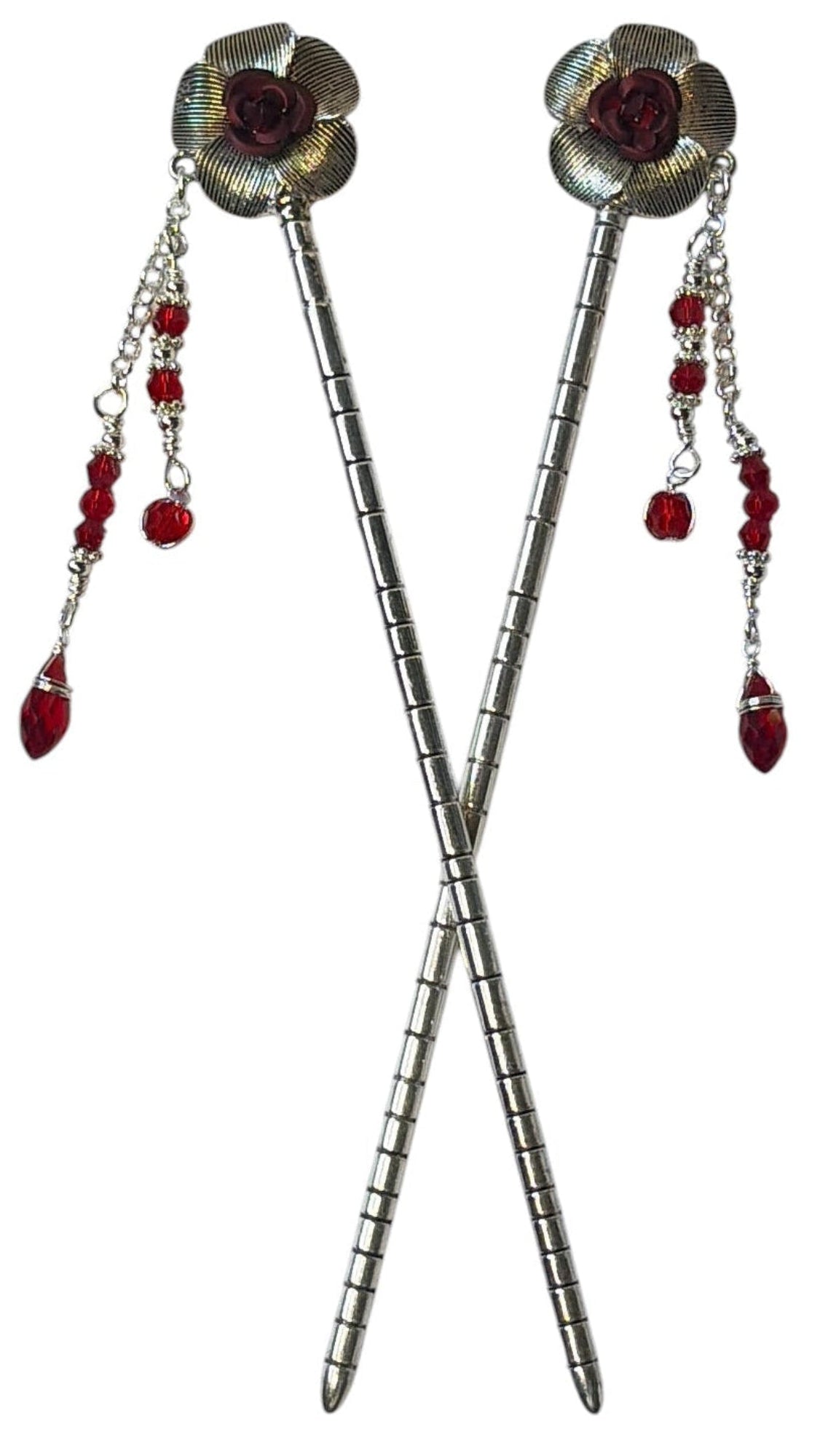 Pair of silver flower hair sticks with red rose centers and red crystal bead dangle chains, shown crossed on a white background to display the front view.