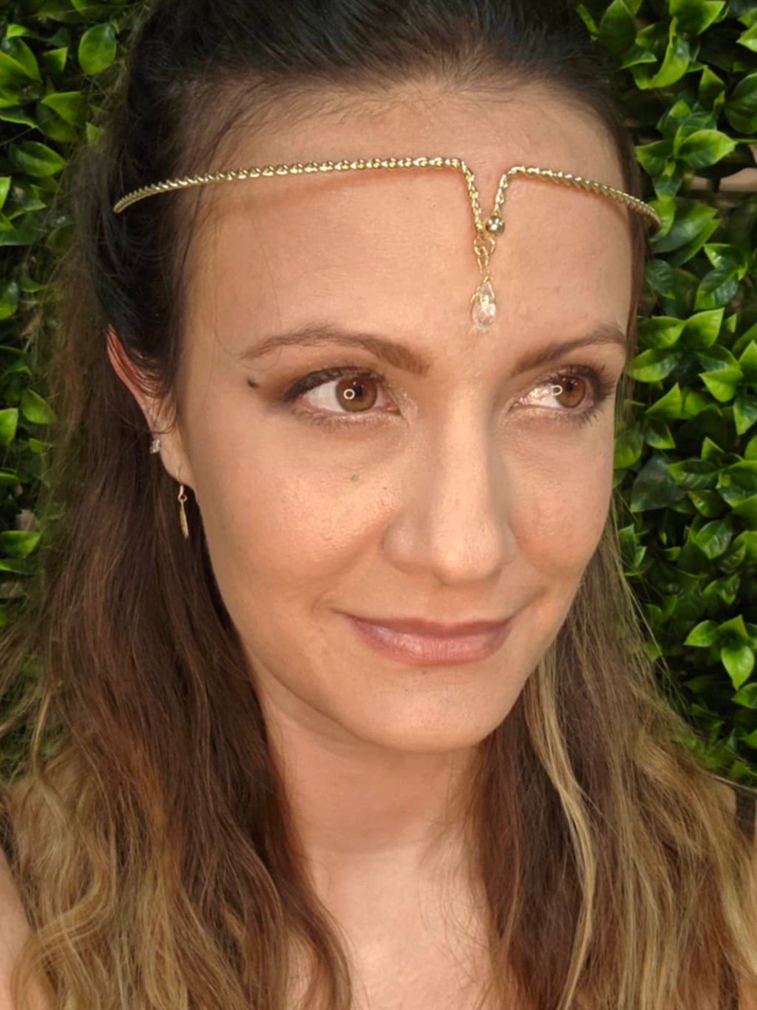 Gold twisted wire forehead band with clear crystal drop accent