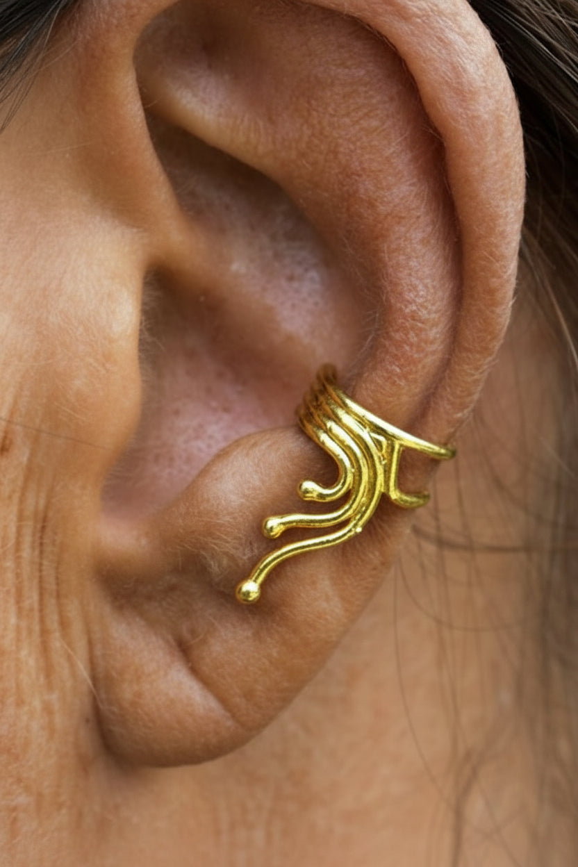 gold spiral wave ear cuff on ear non piercing earring side view