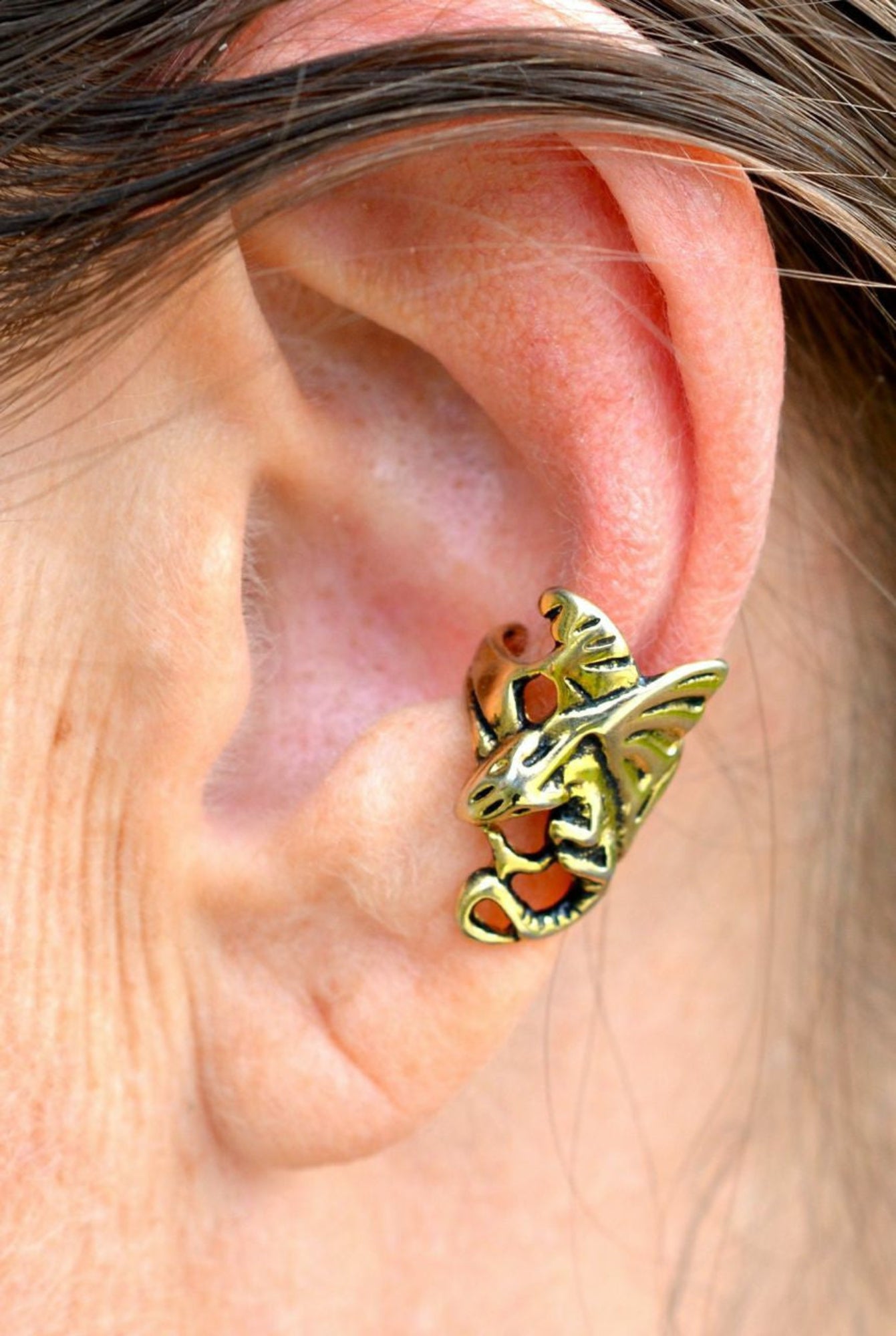 gold dragon ear cuff worn on ear non piercing earring side view