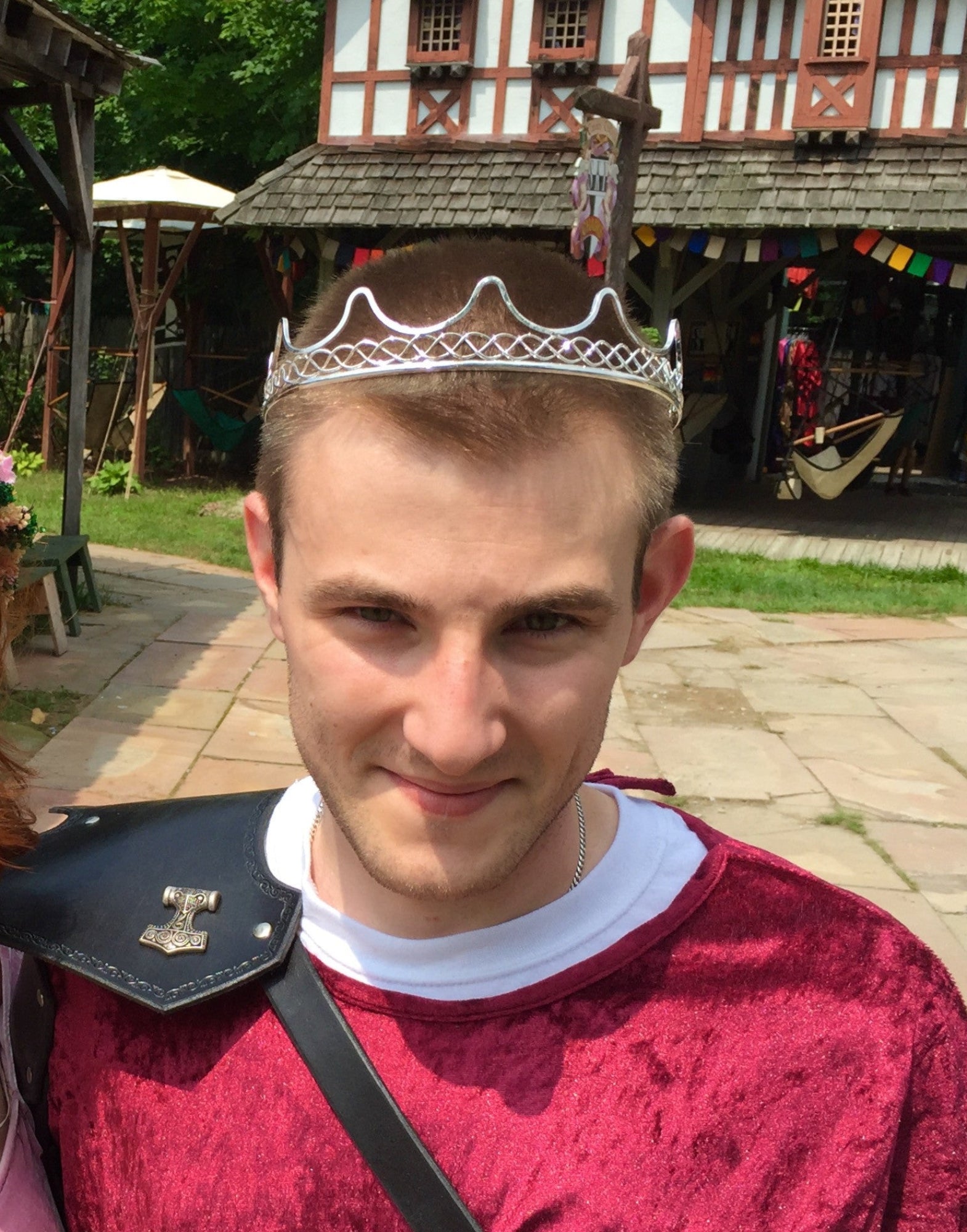 model wearing silver wire royal crown headpiece at renaissance faire
