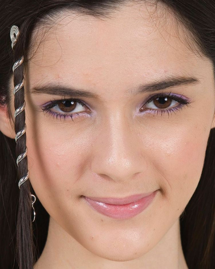 Close-up portrait of model wearing Silver 4-Inch Spiral Hair Twister with Charm along side of face