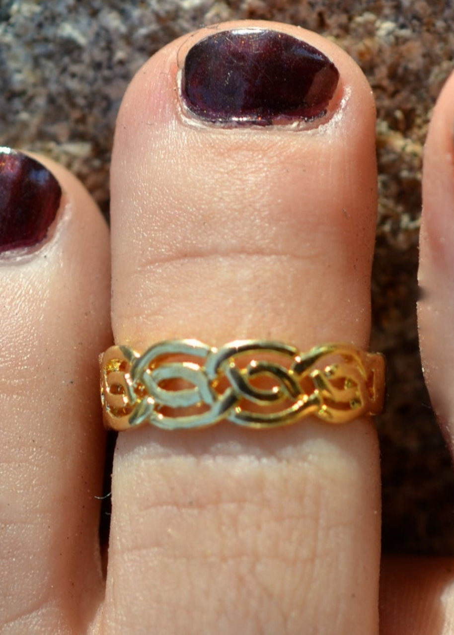 Gold Celtic woven adjustable toe ring worn on toe
