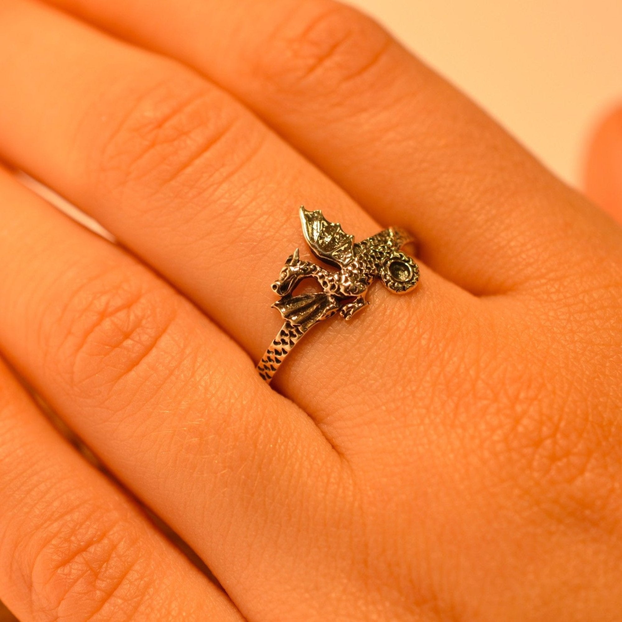 Model wearing sterling silver dragon ring
