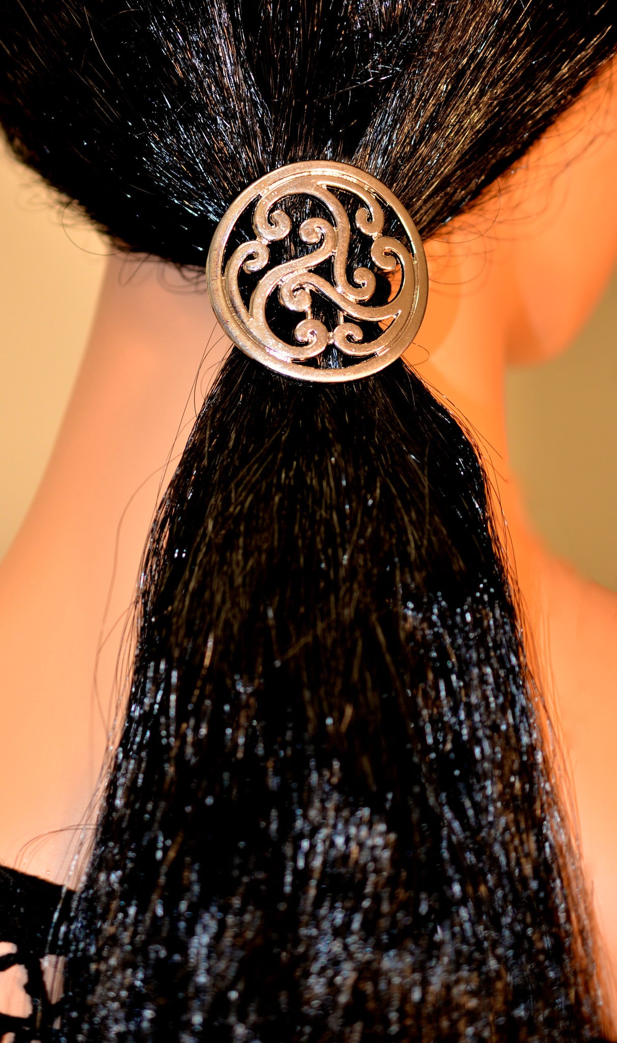 Close-up of model wearing Silver Celtic Hair Hook ponytail holder, elegant knot