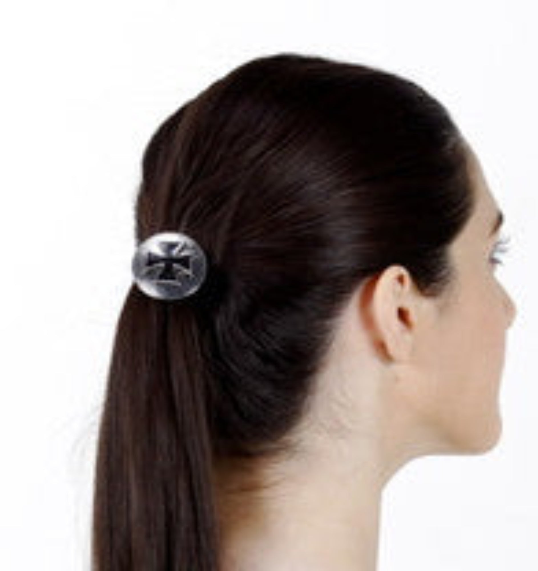 Silver biker cross hair hook ponytail holder worn in dark brown ponytail, side profile view