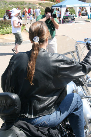 odel wearing Silver Celtic Hair Hook ponytail holder in motorcycle lifestyle setting
