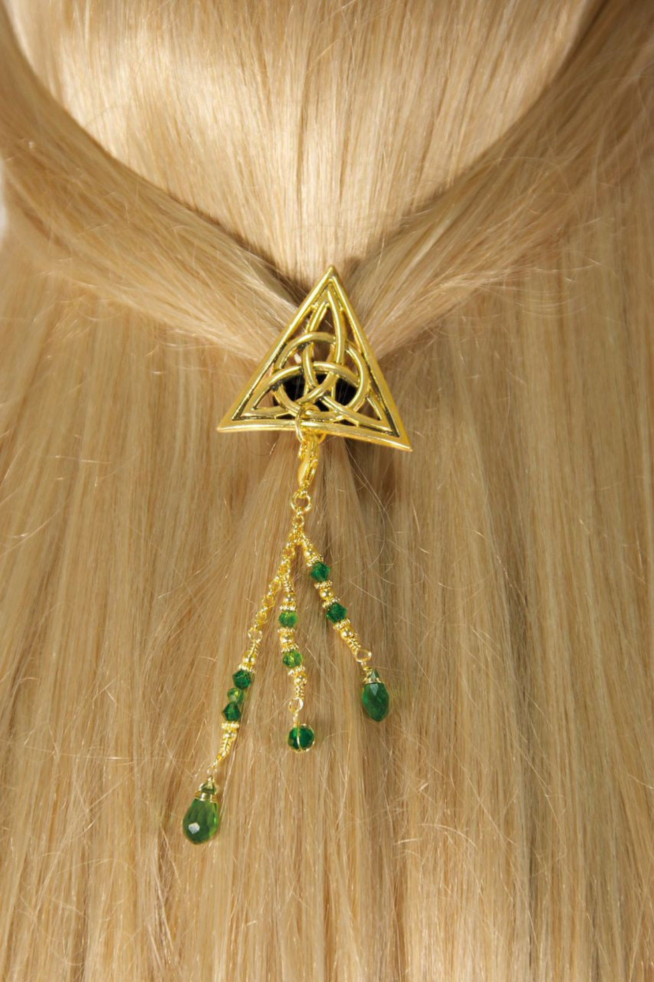 Gold Celtic triangle hair hook with dangling green bead charms worn in ponytail, back view