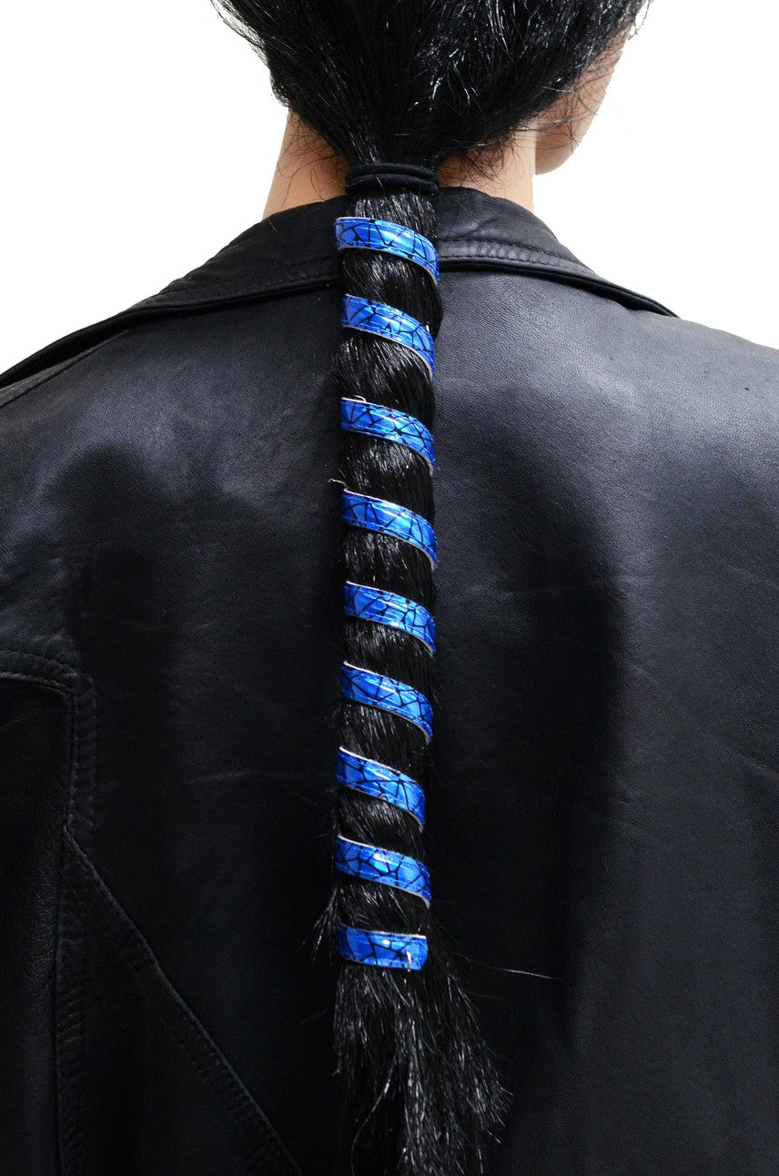 Model wearing 12 inch holographic blue anodized aluminum ponytail wrap, spiral design, back view in ponytail