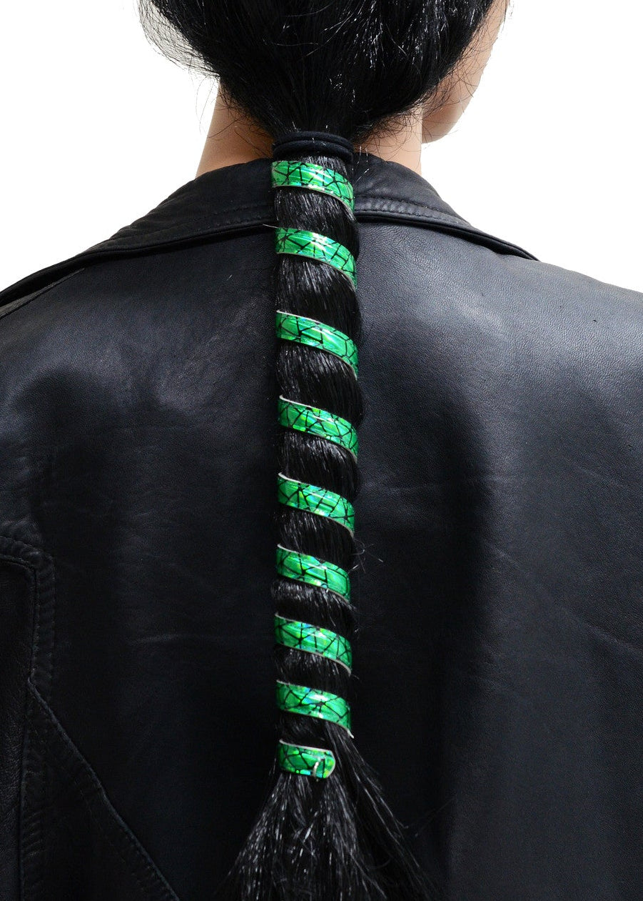 Model wearing 12 inch holographic green anodized aluminum ponytail wrap, spiral design, back view in ponytail