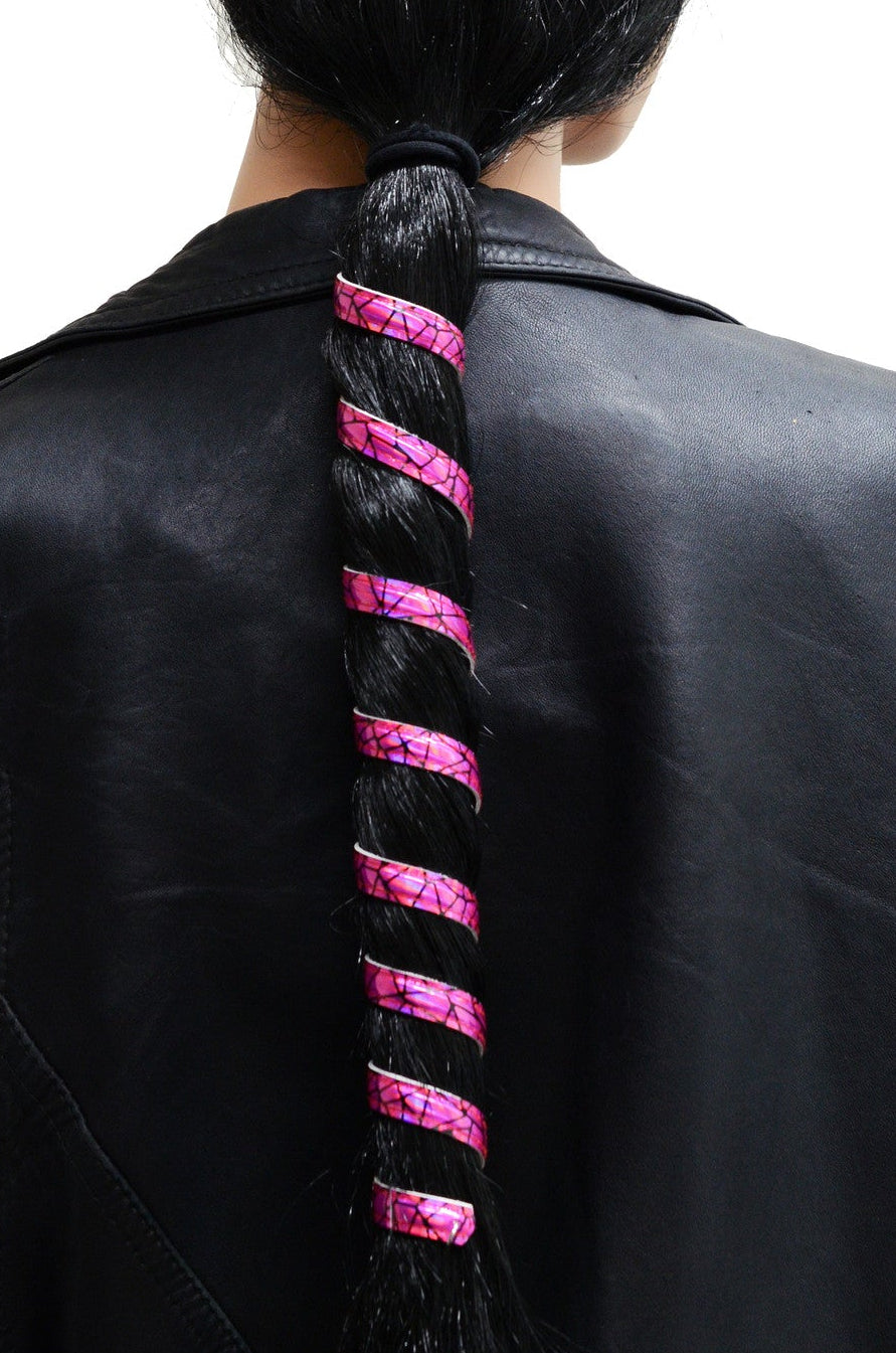 Model wearing 12 inch hot pink holographic anodized aluminum ponytail wrap, spiral design, back view in ponytail