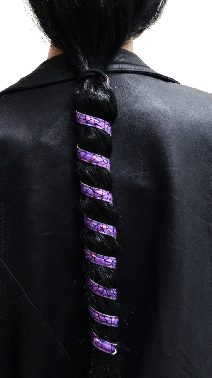 Model wearing 12 inch purple holographic anodized aluminum ponytail wrap, spiral design, back view worn in a ponytail