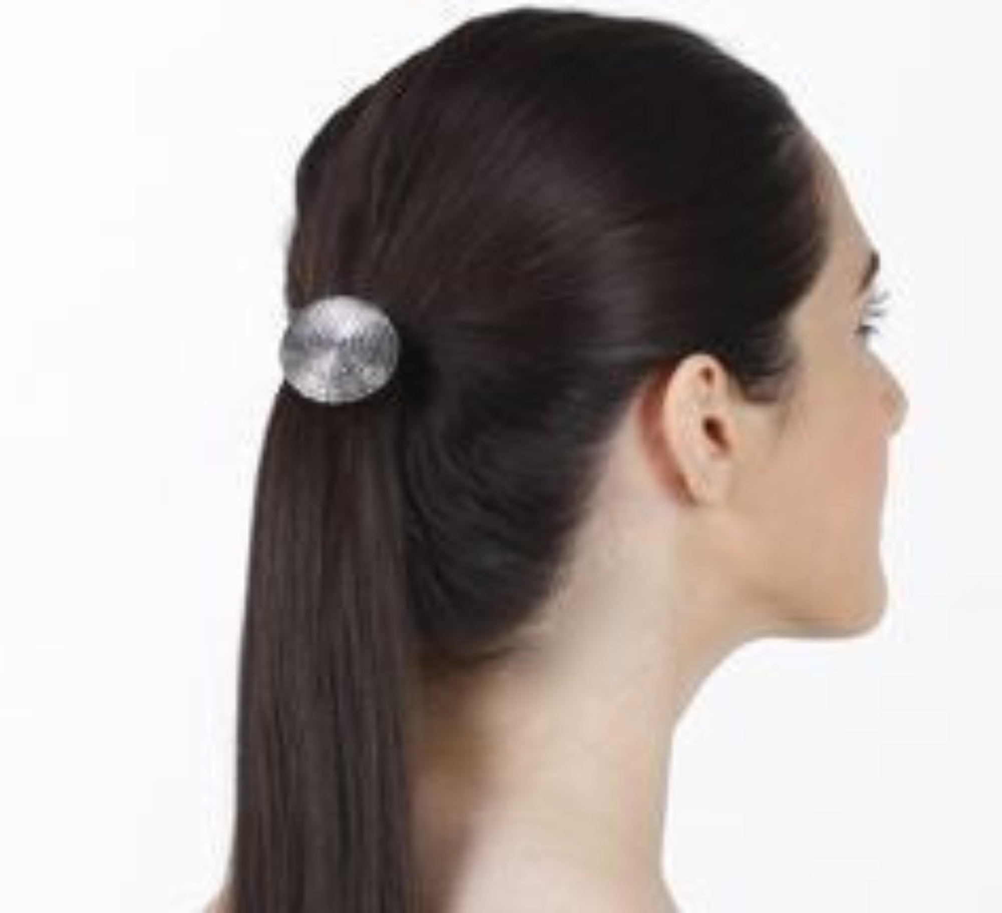 Model wearing silver spiral circle hair hook securing low ponytail, side view