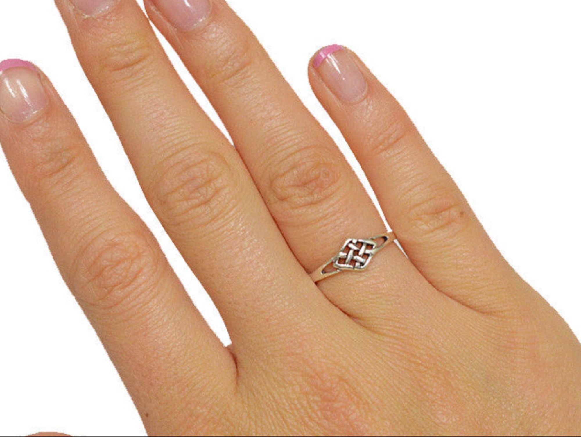 Model wearing sterling silver Celtic bullseye knot ring