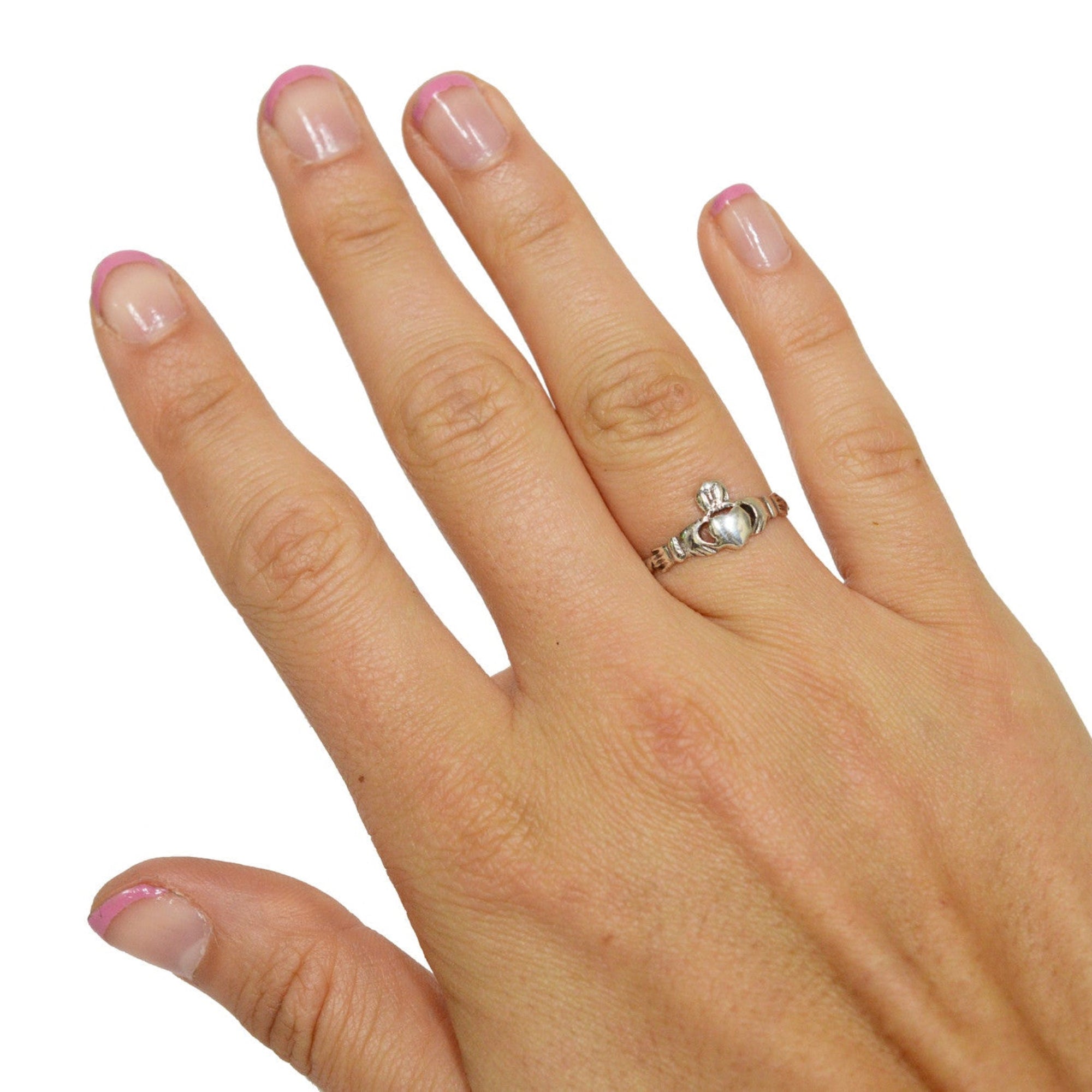 Model wearing sterling silver claddagh thin band ring