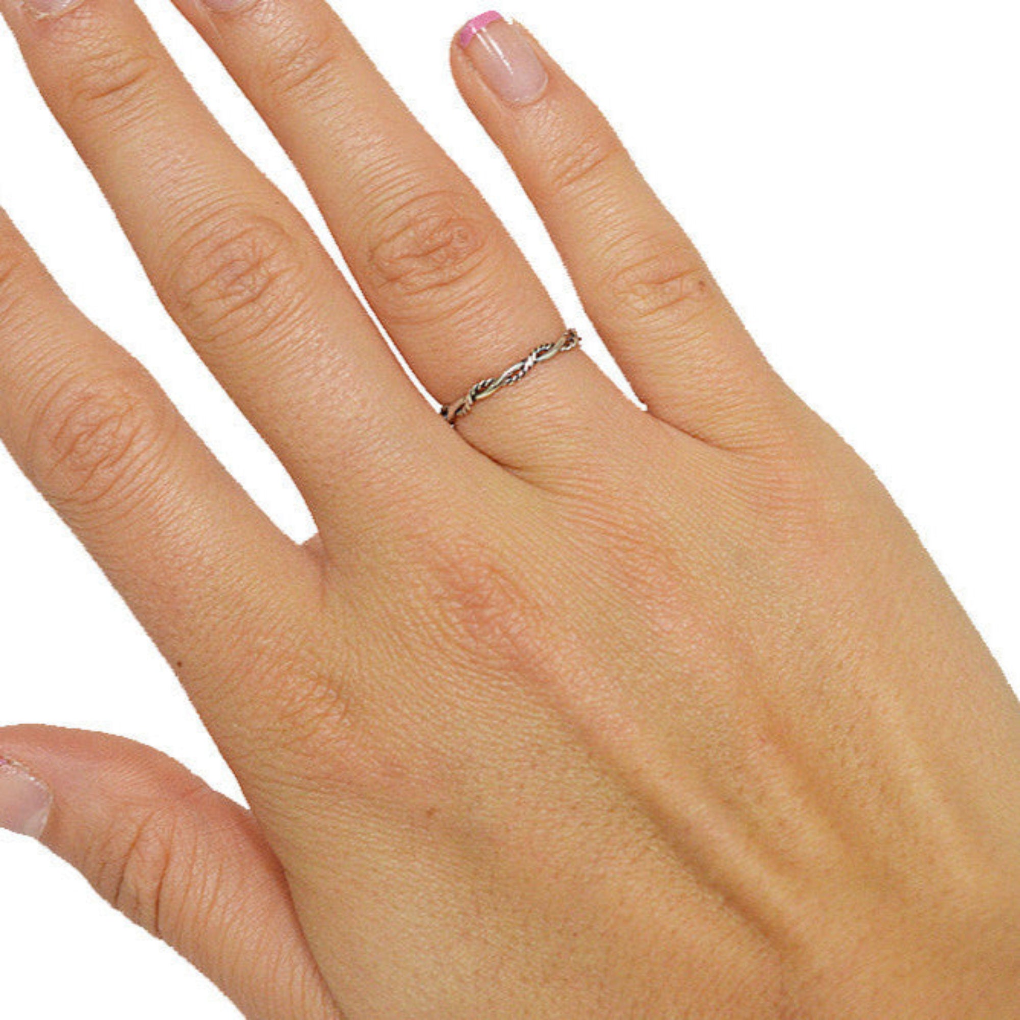 Model wearing Intertwined Rope Band Ring – Sterling Silver Elegant Twist