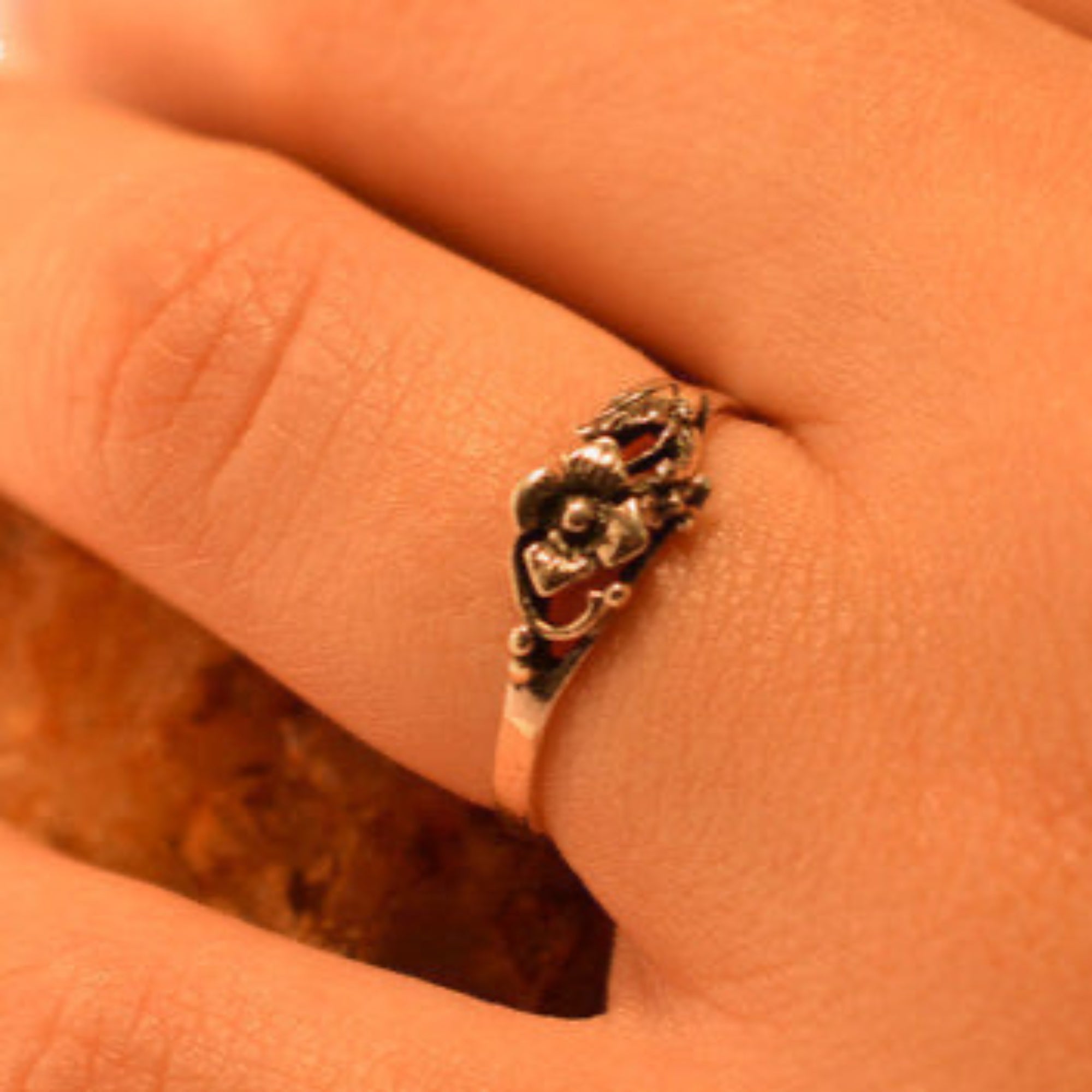 Model wearing sterling silver rose ring

