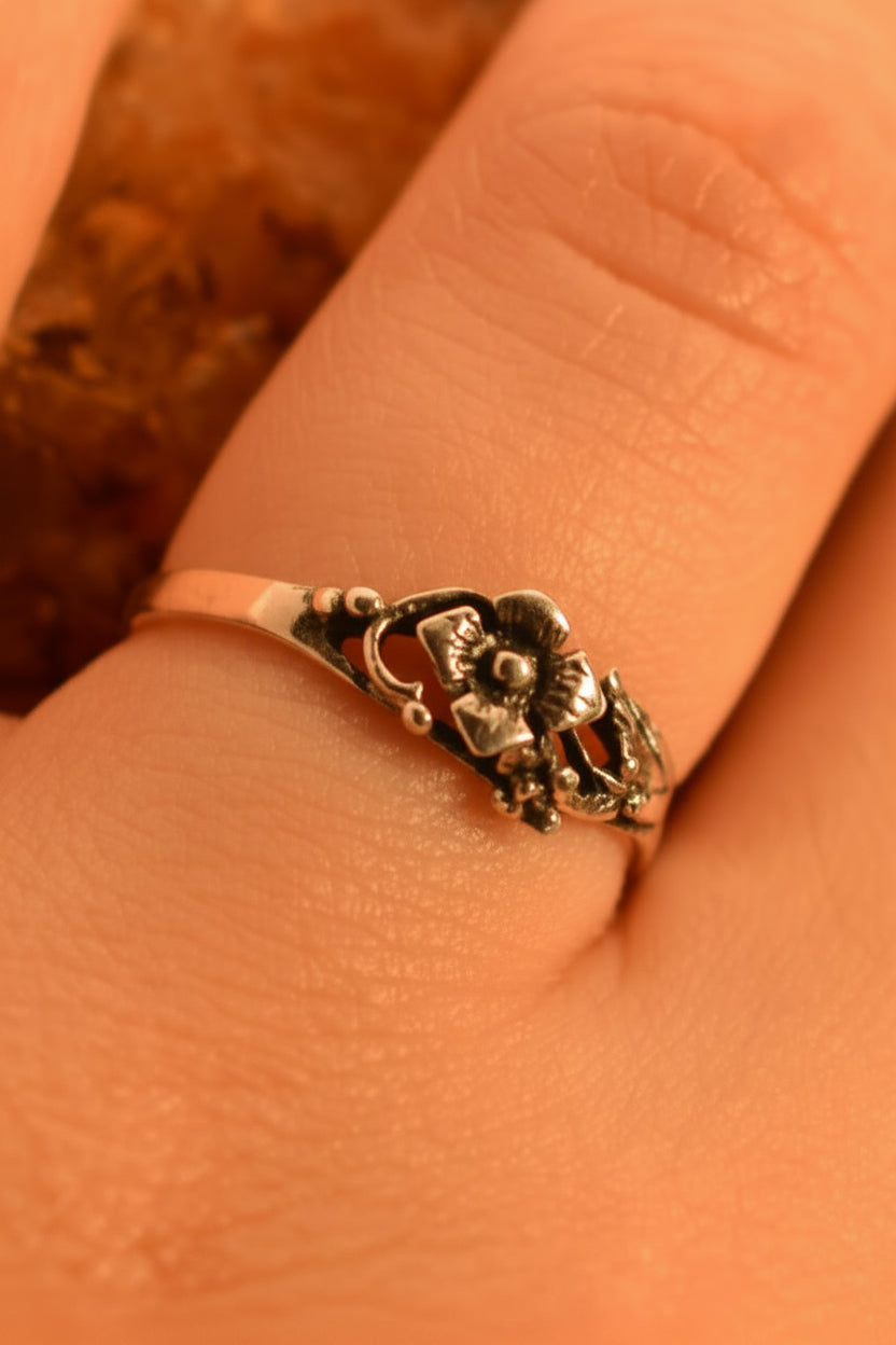 Model wearing sterling silver rose ring
