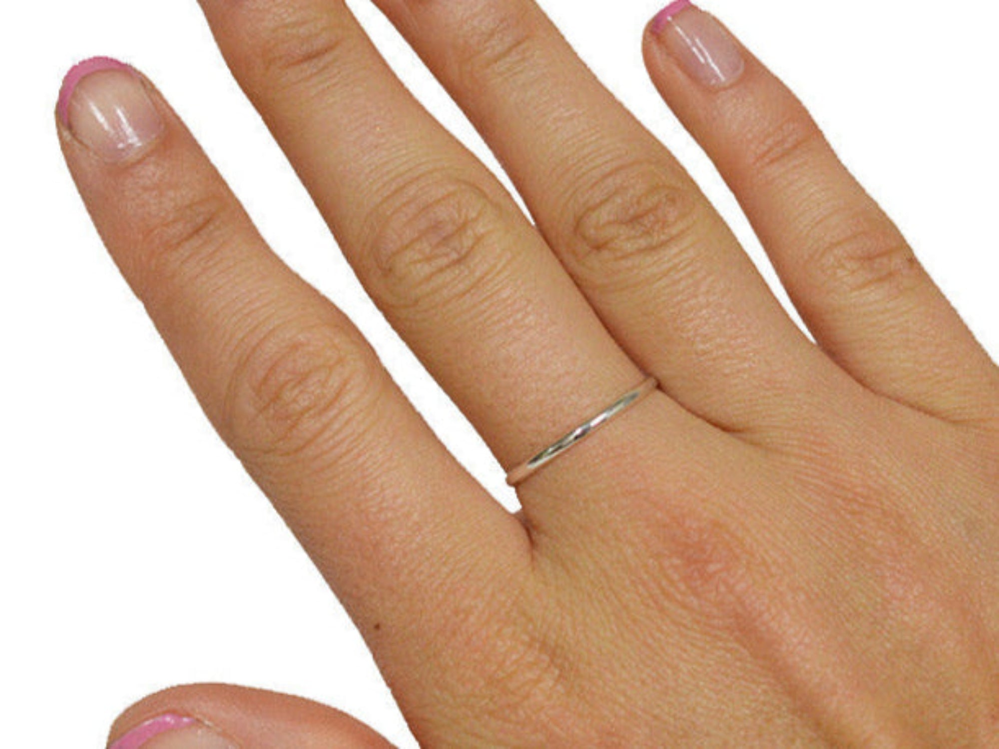 Thin sterling silver band ring worn on finger