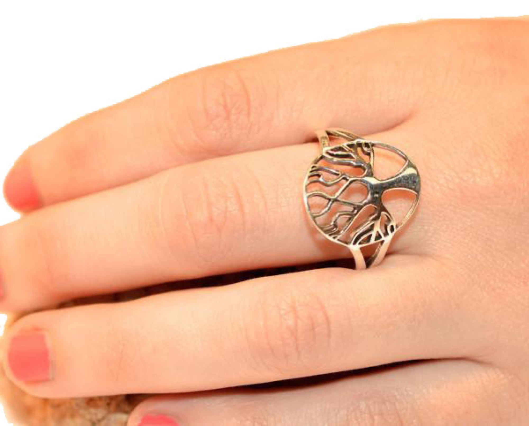Model wearing sterling silver tree of life ring