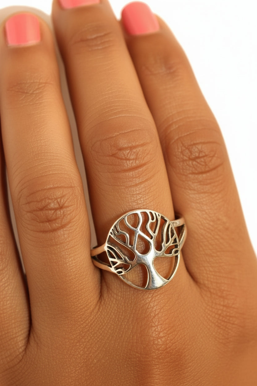 Model wearing sterling silver tree of life ring