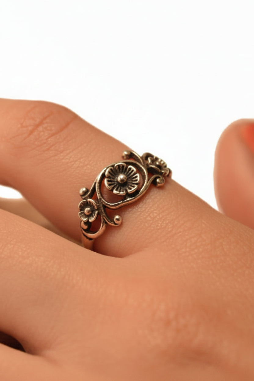 Model wearing sterling silver wild flower floral ring