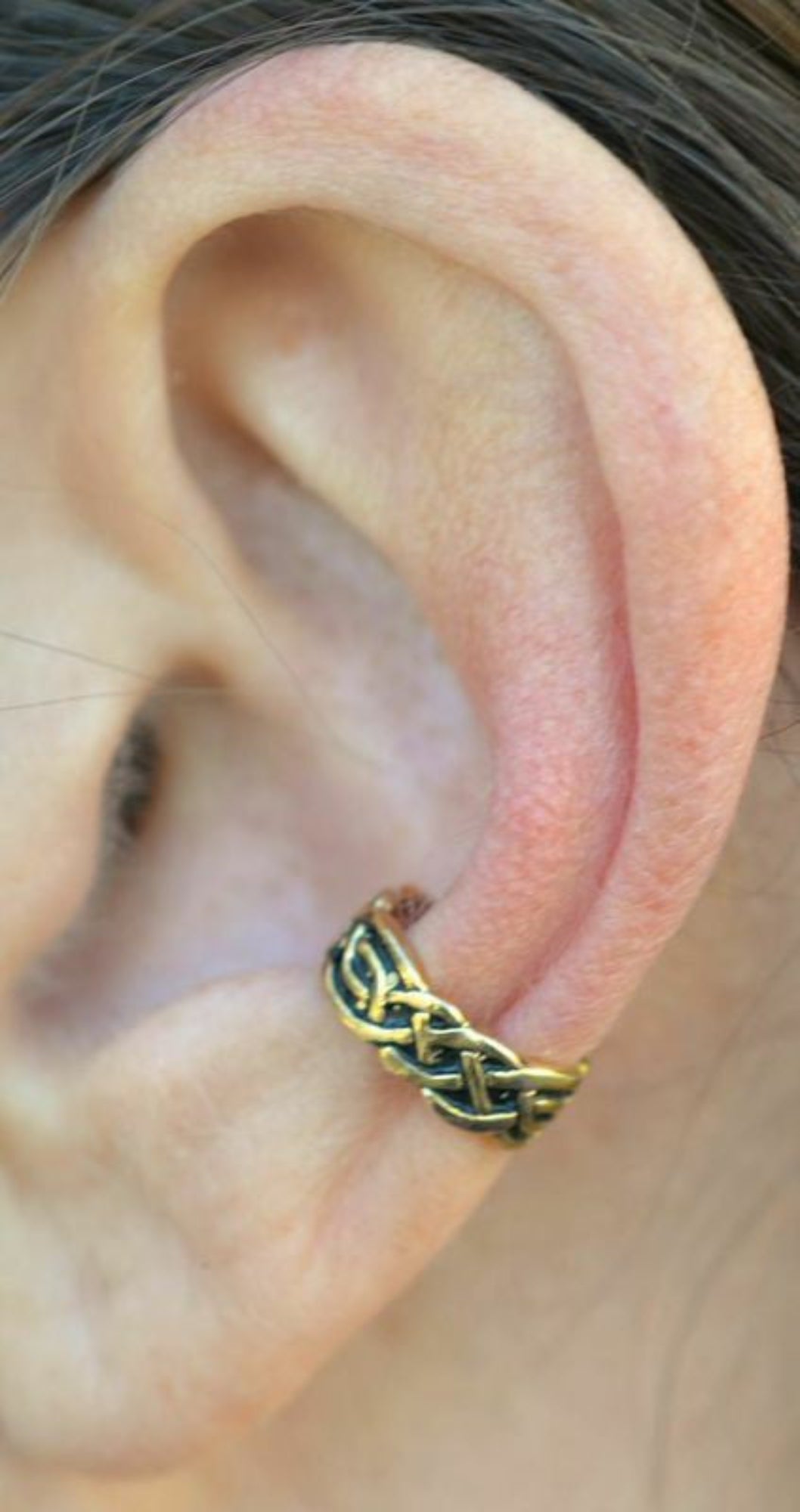 gold celtic knot ear cuff worn on ear non piercing earring side view