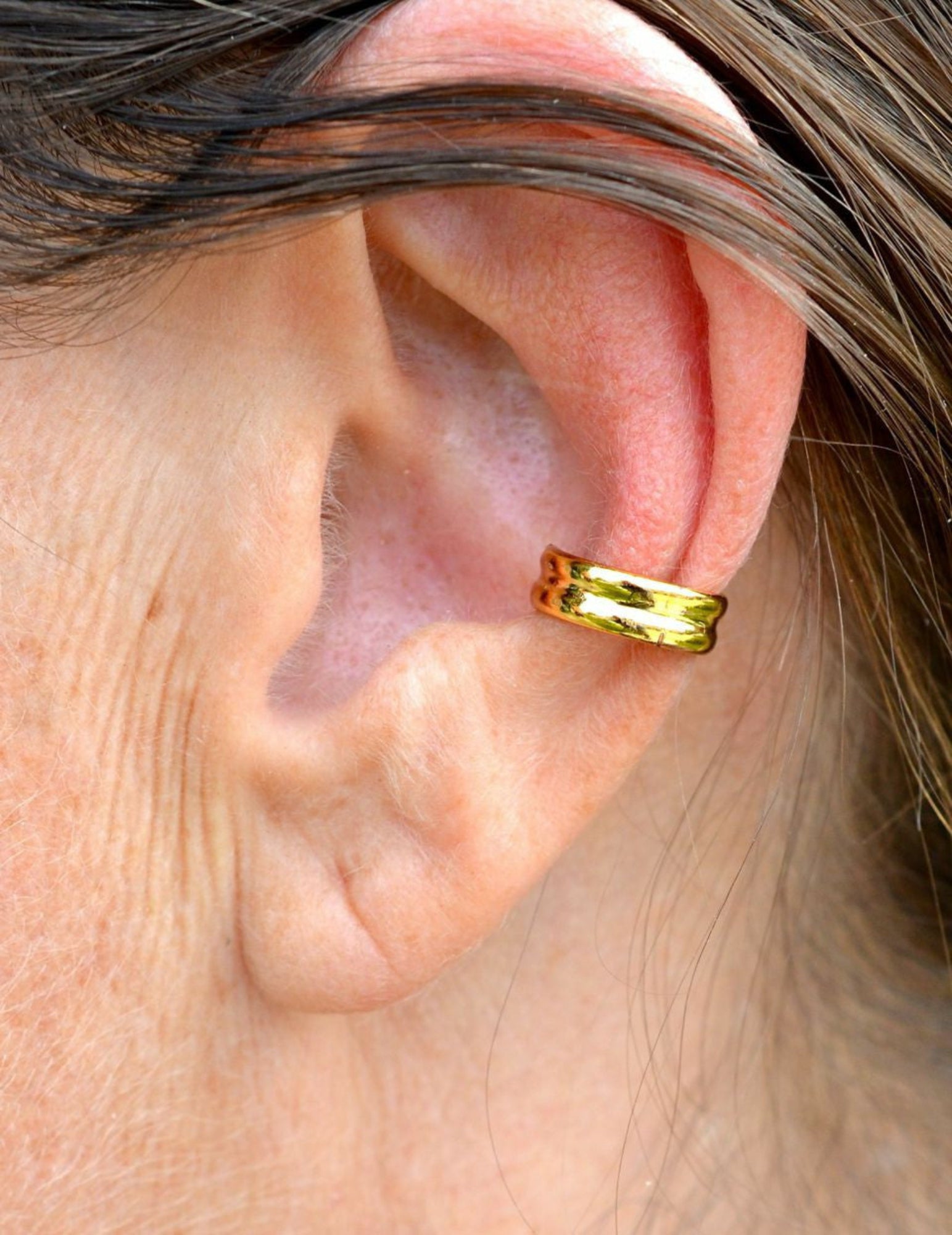gold double band ear cuff worn on ear non piercing earring
