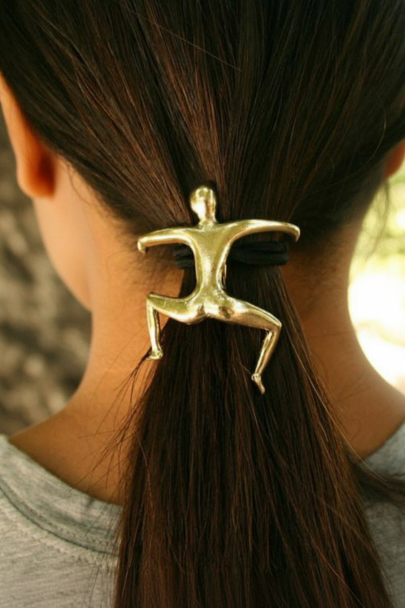 Gold Hang Man ponytail hair hook securing ponytail, back view