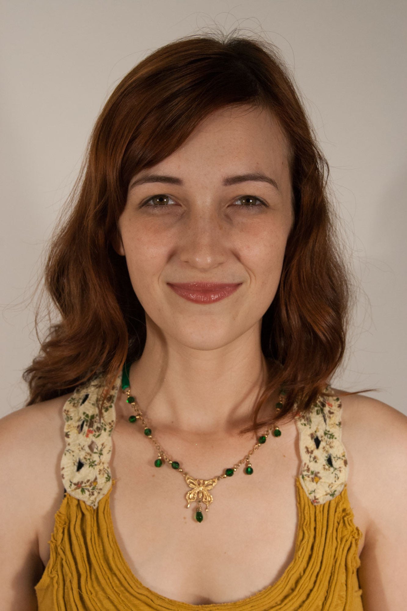 gold butterfly crown necklace with pink bead dangles tie on ribbon jewelry front view