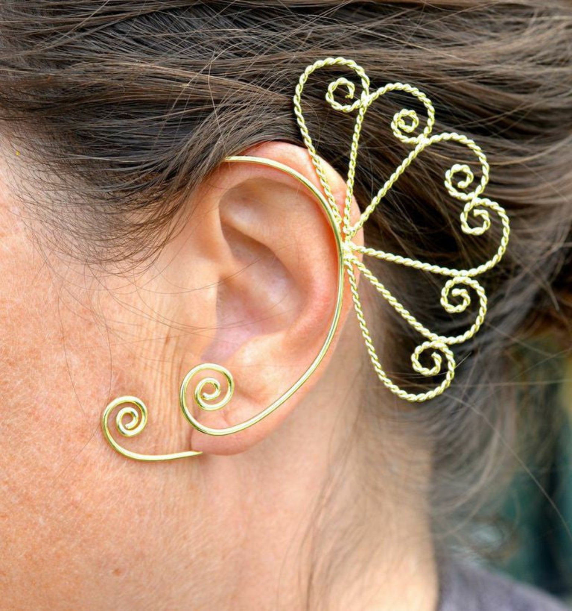 gold spiral heart elf ear cuff worn on ear non piercing wire wrap ear jewelry side view