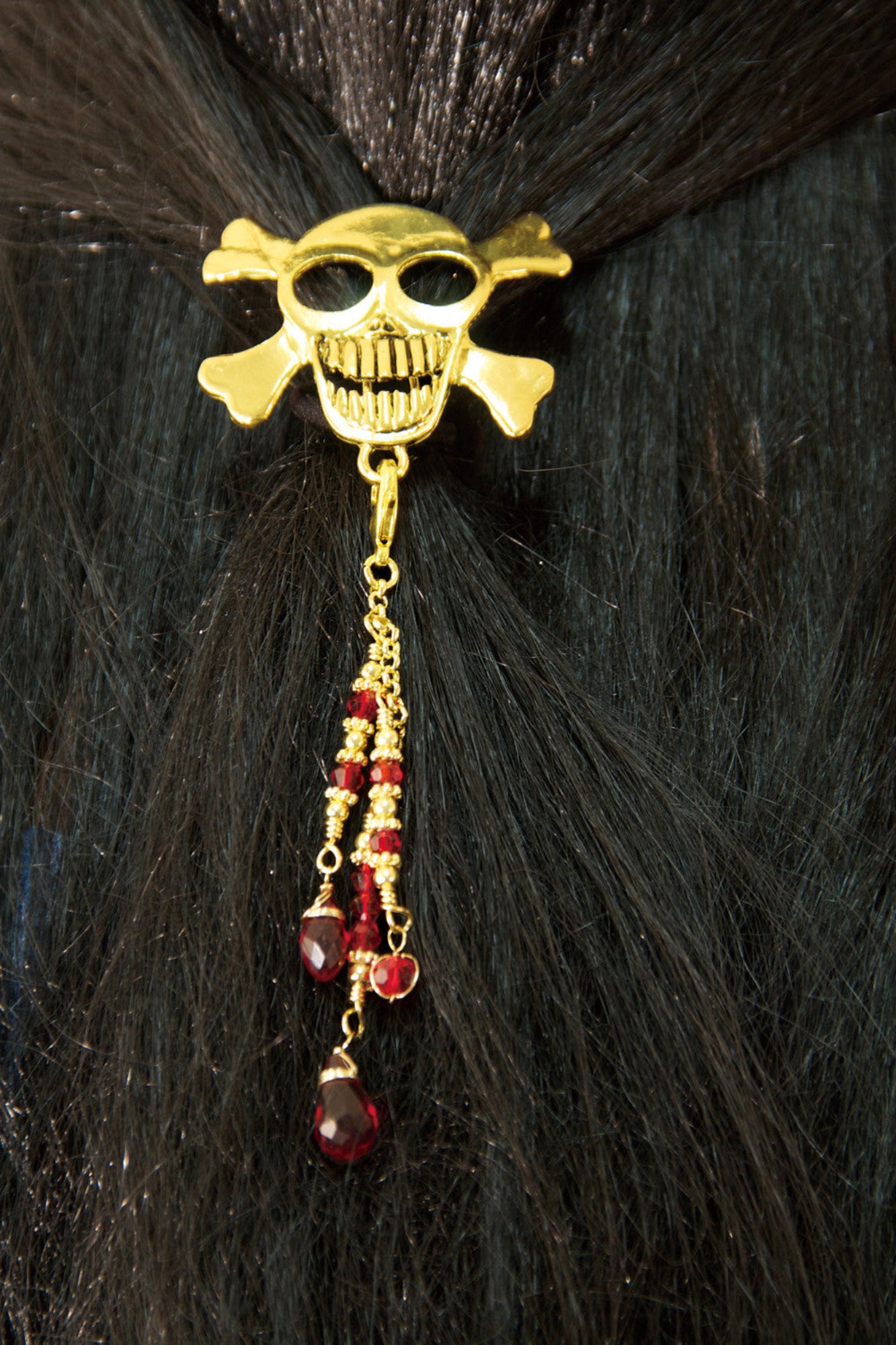 Model wearing Hair Hook Gold Skull with Bead Charm Ponytail Holder