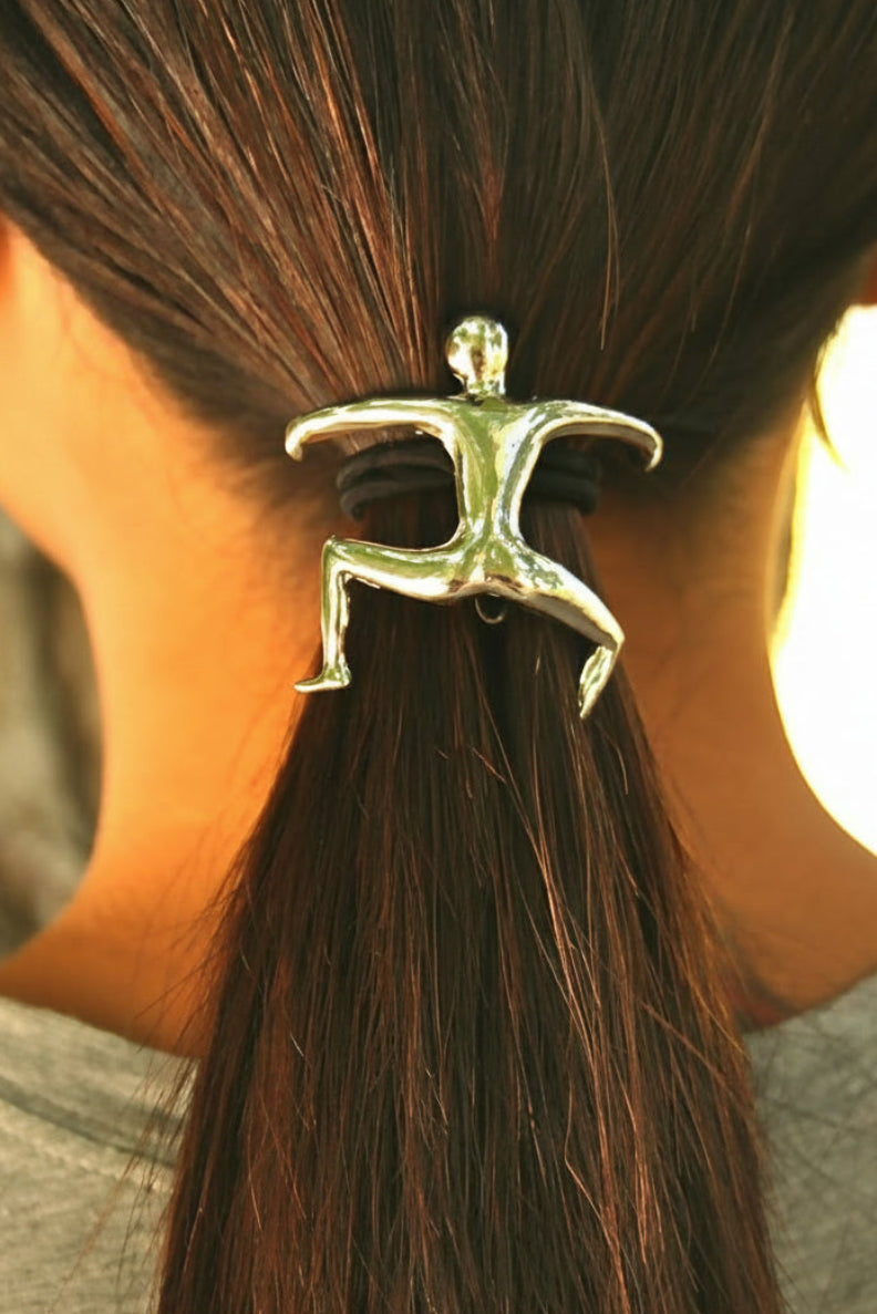 Model wearing silver Hang Man ponytail hair hook, back view