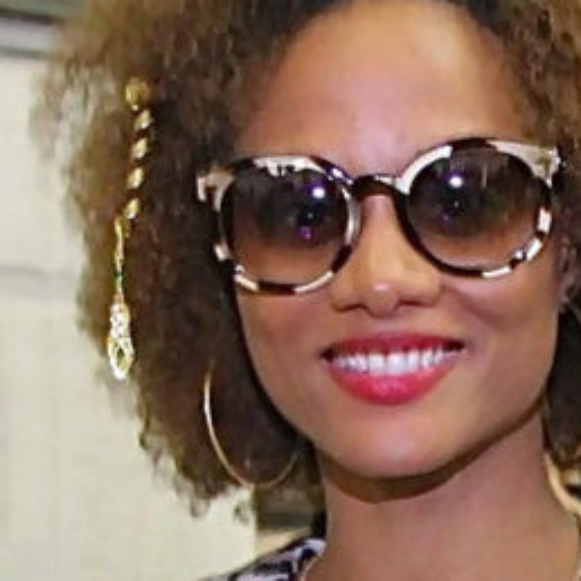 2 inch gold spiral hair twister worn in curly short hair, angled view