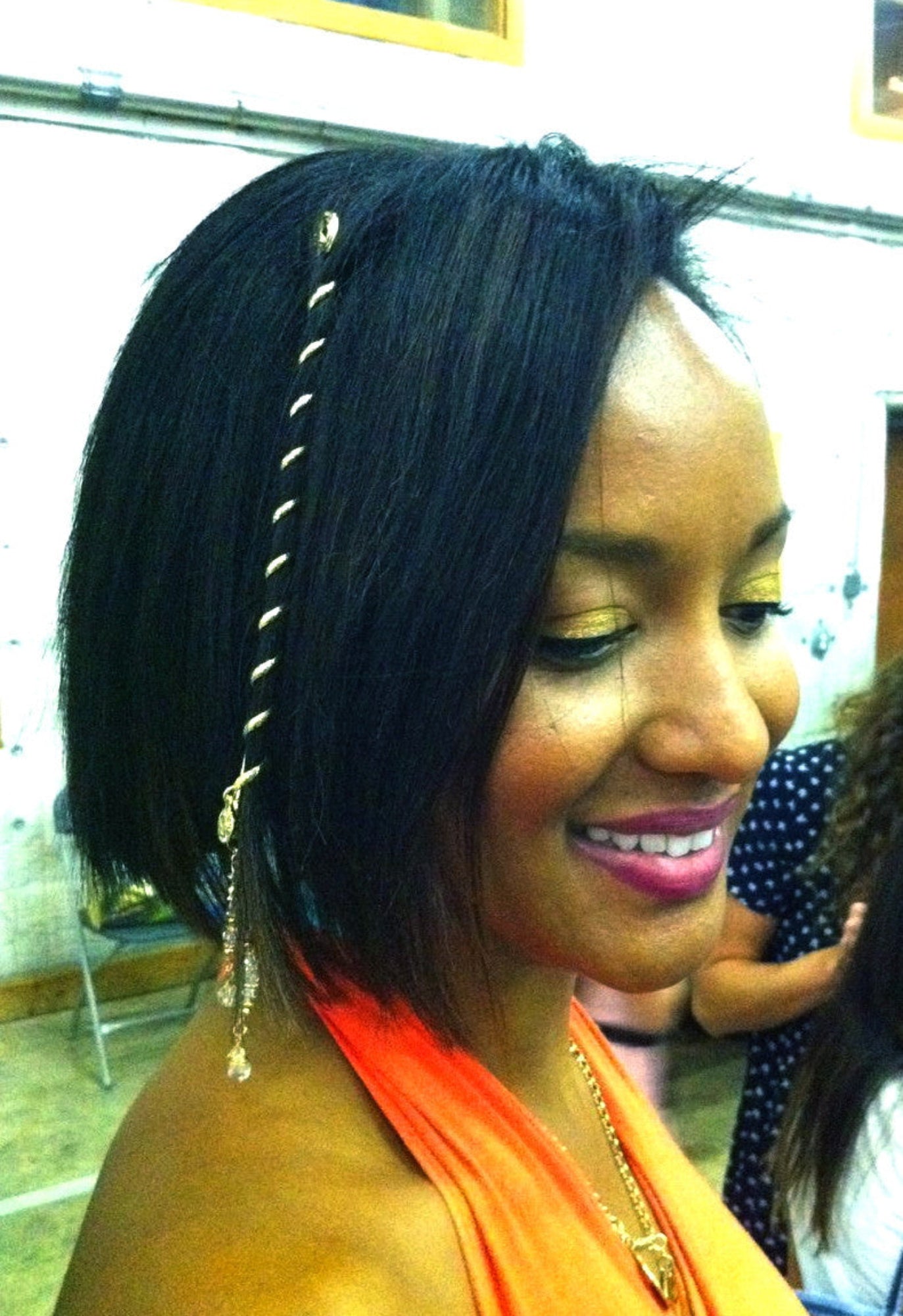 6 inch gold spiral hair twister worn in short hair, angled side view