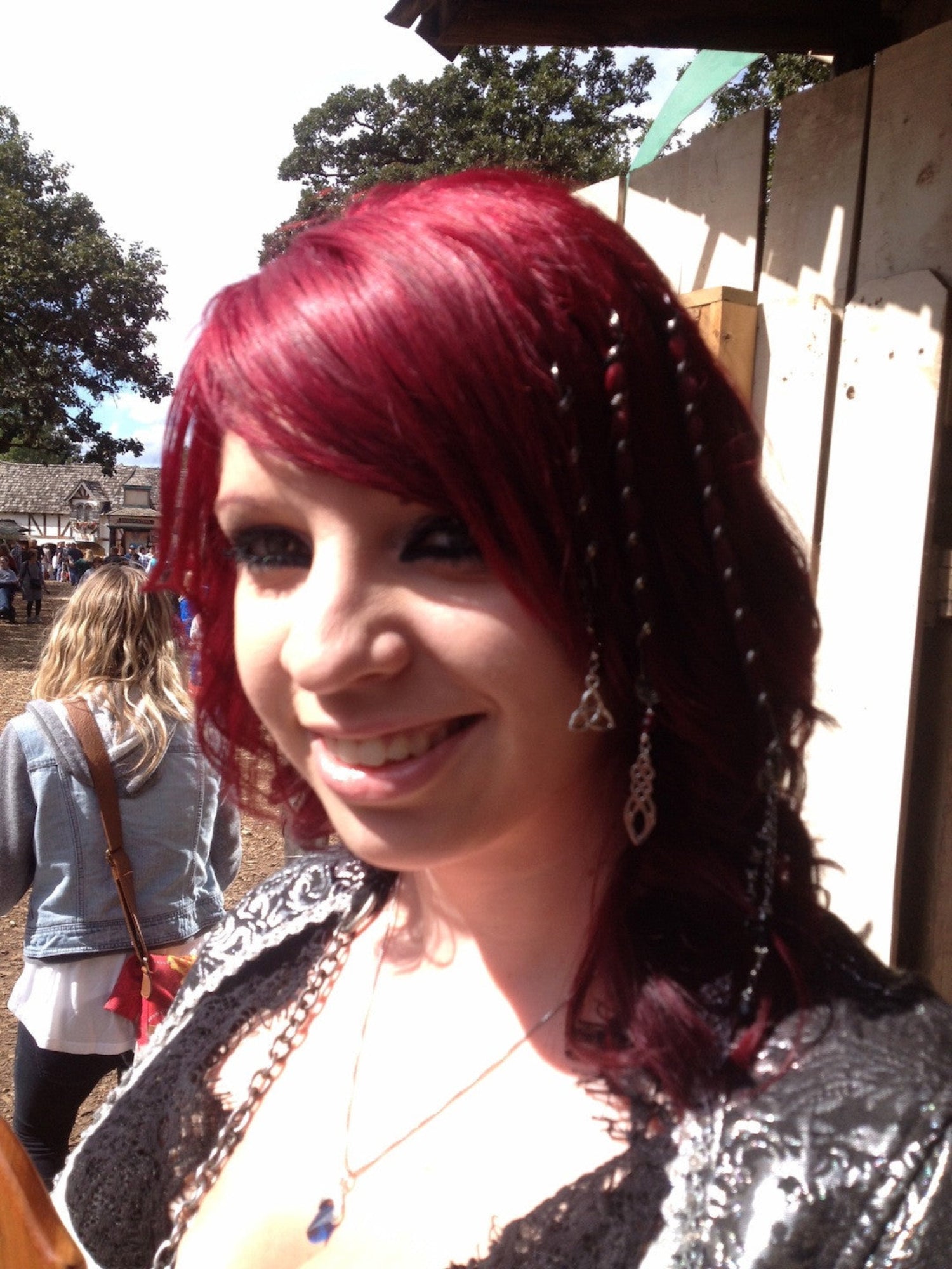 6 inch gun black spiral hair twister worn in long hair, angled side view