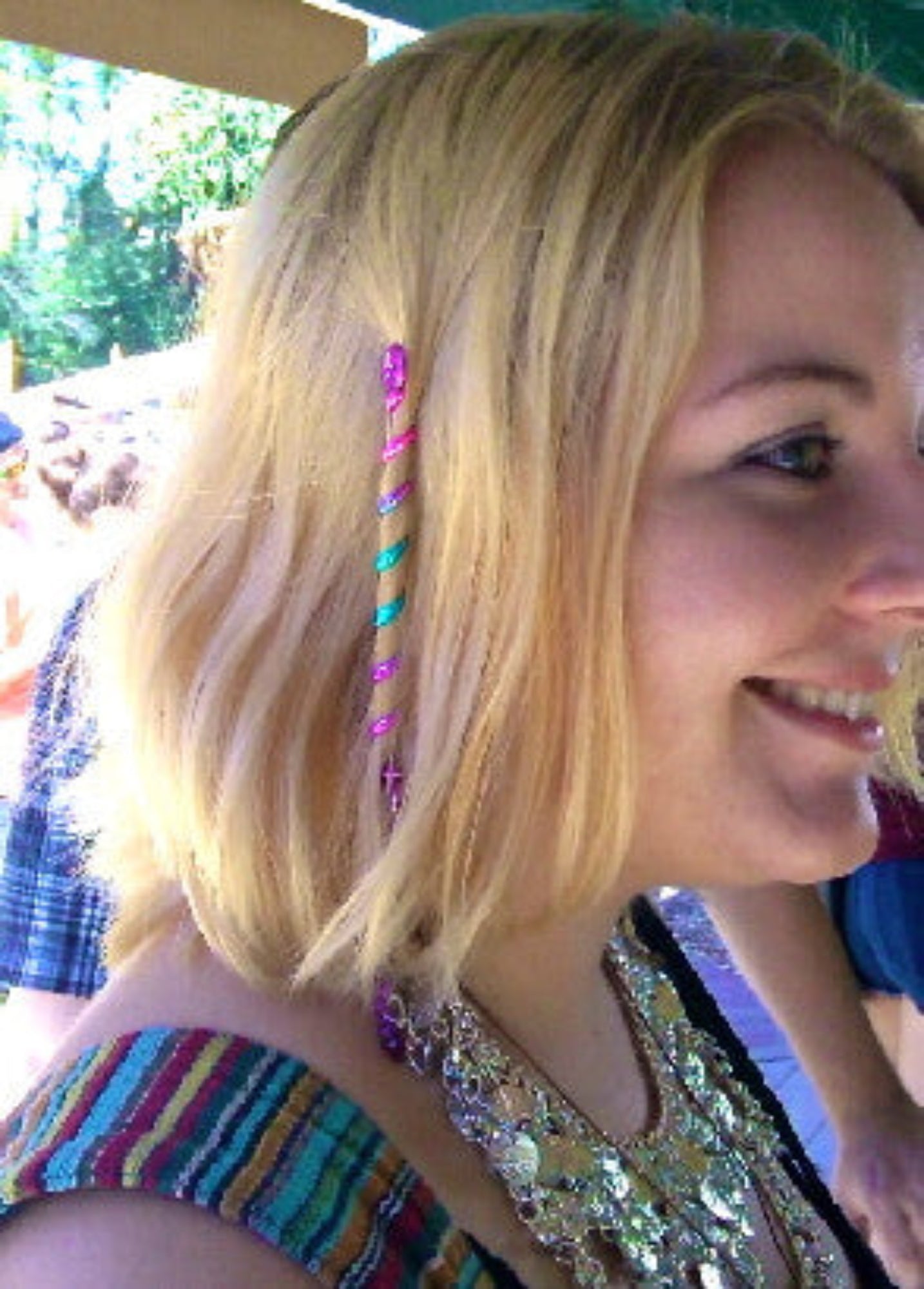 Model wearing 4 inch purple rainbow spiral hair twister, side view
