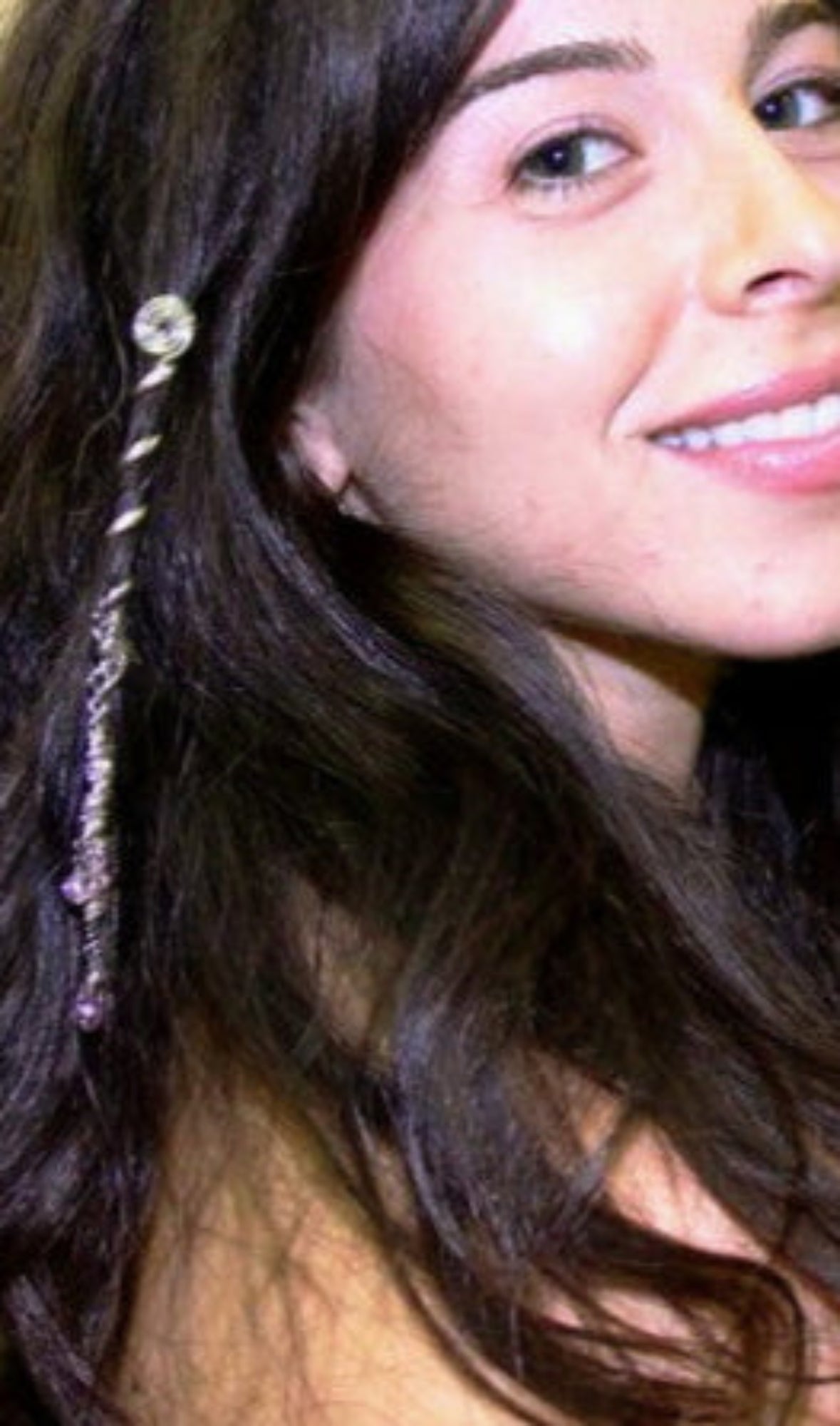 Model wearing 2 inch silver mini spiral hair twister with charm, side view